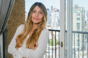 Fototapeta premium portrait of young latin business woman at home
