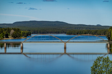 Vindeln, Sweden A steel car bridge crosses the Pitea River on a sunny day.