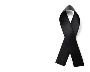 black mourning ribbon isolated on a white background with space to add text 