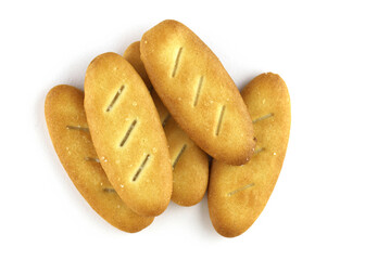 Salted crackers on a white background. Crispy biscuits top view. Top view of low calories thin oval crackers. Tasty snack