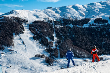Skiers on a slope of Livigno