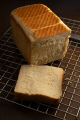 bread on a sieve on a wooden table