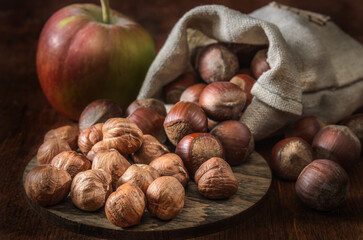 hazelnuts in a woven bag and other fruits