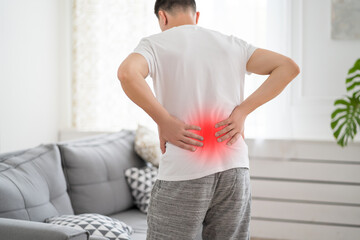 Back pain, kidney inflammation, man suffering from backache at home - obrazy, fototapety, plakaty