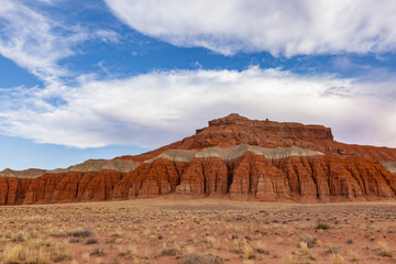 Fototapeta premium Rocky block of cliffs in the shape of towers. Located in south-central Utah in the heart of red rock country, Capitol Reef National Park Utah is a hidden treasure filled with cliffs, canyons, domes, a