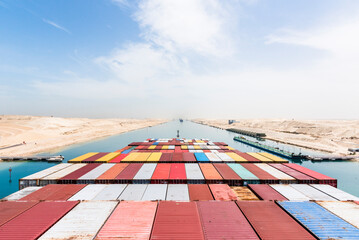 View on the containers loaded on deck of cargo ship. Vessel is transiting Suez Canal on her...