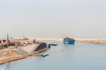 Landscape of the Suez Canal, view from the transiting cargo ship.