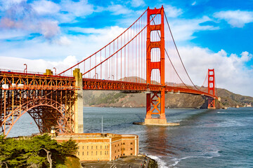 Amazing Golden Gate of San Francisco in the state of California, USA under a beautiful blue sky and ocean. Seen from the viewpoint of the Californian city's waterfront. American bridge concept.
