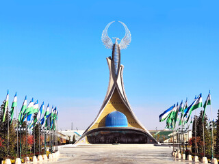 stella new uzbekistan park in uzbekistan humo bird and flags blue dome - obrazy, fototapety, plakaty