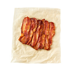 fried bacon strips on a parchment isolated on white background, top view.