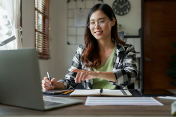 Portrait of Young creative startup woman at workplace..