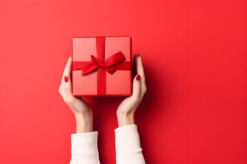 Hands with small christmas gift box on red background, ai generated
