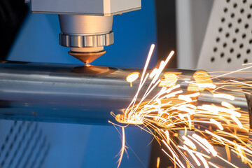 Close up scene the fiber laser cutting machine cutting  machine cut the stainless steel tube.