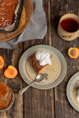 Fototapeta na wymiar Malva pudding is a traditional South African dessert that is typically served warm and accompanied by a creamy sauce or custard. It is a sweet and sticky sponge pudding with a caramelized texture and 