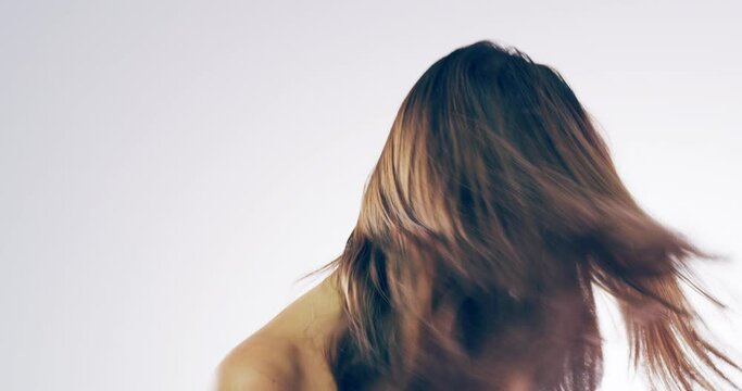 Hair shake, beauty and face of woman in studio for wellness, haircare treatment and cosmetics. White background, salon and portrait of female person with hairstyle for healthy texture, style and glow