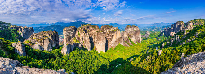 Meteora, Greece. Incredible sunrise view of sandstone rock formations and monasteries. - obrazy, fototapety, plakaty
