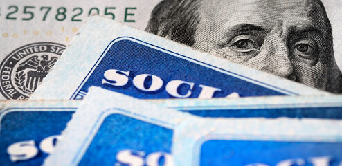 Social Security Cards with US One Hundred Dollar Bill $100