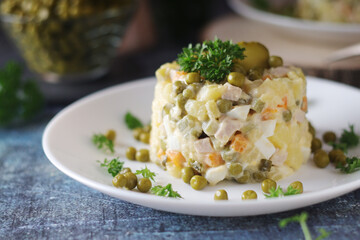 Olivier salad, traditional Russian dish, served on the plate
