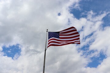 The american flag waving un the wind.