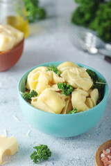 A bowl with Italian dumplings - tortellini	