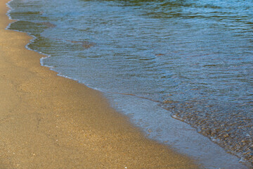Sand and sea water on the beach in Angra do Reis, in Rio de Janeiro. Sunny day in the morning. Close-up