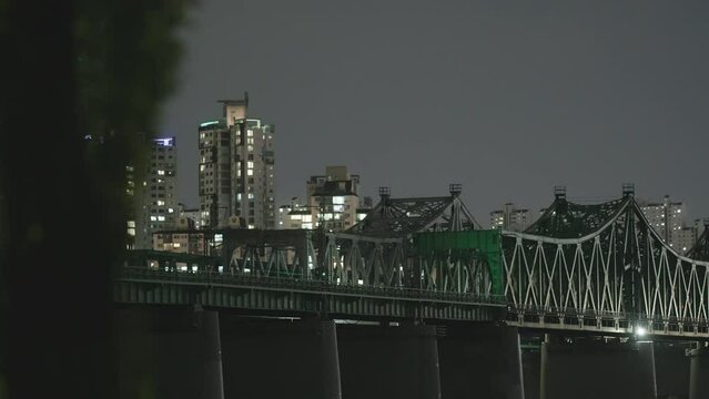 Night Train Crossing Han River Bridge in Seoul