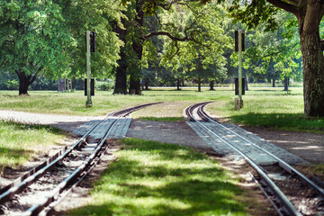 Narrow-gauge railway tracks in the center of the city park