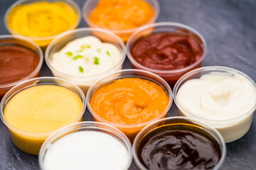 Different flavored sauces next to each other.