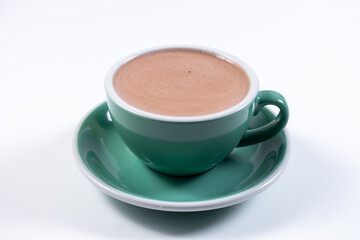 closeup of delicious cacao drink in ceramic cup on white background