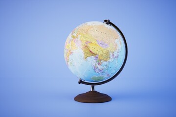 The concept of traveling around the world. Globe on a stand on a blue background. 3D render
