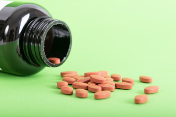 close up of medicine pills on green  background