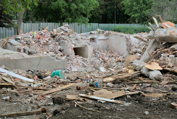 Destroyed apartment building. Demolished walls and pieces of furniture