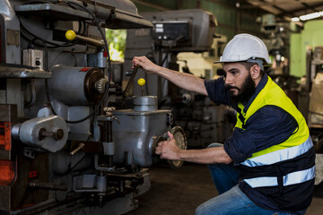 Engineer Factory man working with heavy machinery in industrial factory
