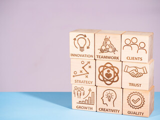 Symbols of core values on wooden blocks as a concept of successful company management