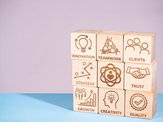 Symbols of core values on wooden blocks as a concept of successful company management