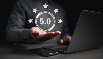 Businessman on hand  get rewarded five star emoticon on virtual touch screen.