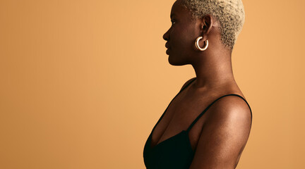 Black woman with blond short hair in studio