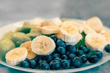 Closeup shot of superfood mix with blueberries, banana and kiwi slices