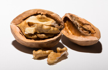 Walnuts are rounded, single-seeded stone fruits of the walnut tree. Cracking a nut.