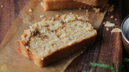 Closeup shot of the sweet egg-free bread made with cinnamon and topped with almond flakes