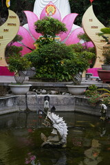 a dove sits on a fountain in a temple