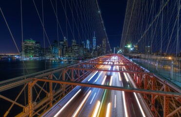 Fototapeta na wymiar Aerial view of the bridge road with light trails and modern buildings in New York City