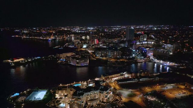 Aerial Time Lapse video of the modern city at night, Malta, St. Julians Bay