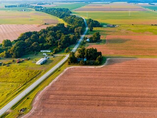 Aerial drone shot of the extensive agricultural fields