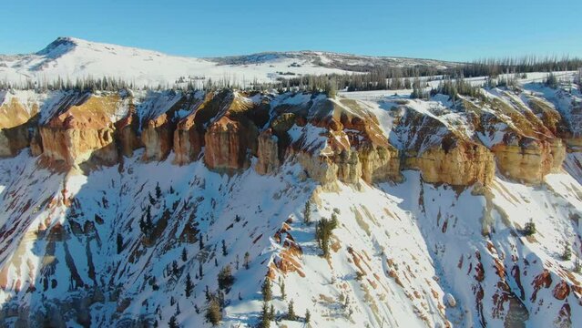 Bird's eye view of Rocky mountains covered with snow in Southern Utah near Brian Head in winter
