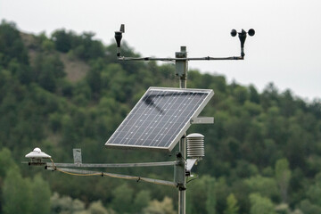 weather station with solar panel placed  - obrazy, fototapety, plakaty