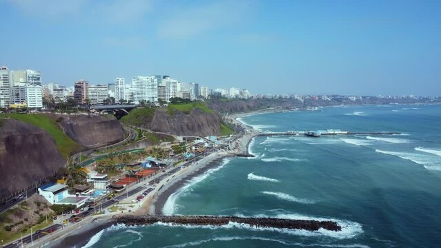 Aerial view of the Miraflores coastline in Lima, Peru - slow motion
