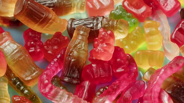 Jelly marmalade cola bottle bear close up, Confiture Bean candy jujube Marmalade bears with cod cannabis close up. 