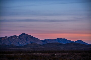 Naklejka na ściany i meble Sunset in the North Mexican Desert with the mountains in the background