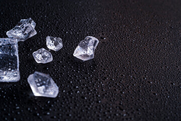 Ice cubes on a black background. Cold background. ice and won on black background